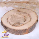 دستبند استیل زنانه زنجیر کارتیر نگینی طلایی | xp 5616